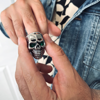 Stainless Steel Green CZ Eyed Cracked Skull Ring